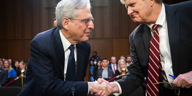 Attorney General Merrick Garland, left, shakes hands with Sen. John Kennedy, R-La., as Garland arrives to testify as the Senate Judiciary Committee examines the Department of Justice, at the Capitol in Washington, Wednesday, March 1, 2023.