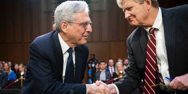 Attorney General Merrick Garland, left, shakes hands with Sen. John Kennedy, R-La., as Garland arrives to testify as the Senate Judiciary Committee examines the Department of Justice, at the Capitol in Washington, Wednesday, March 1, 2023.