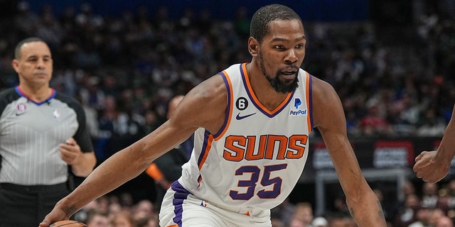 Kevin Durant of the Phoenix Suns handles the ball during the game on March 5, 2023, at the American Airlines Center in Dallas, Texas.