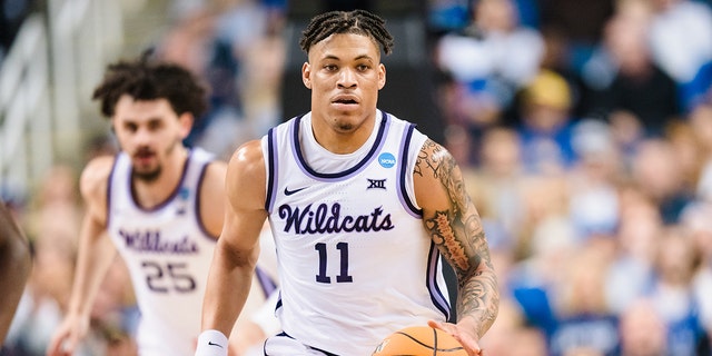 Keyontae Johnson #11 of the Kansas State Wildcats brings the ball up court against the Kentucky Wildcats in the second round of the NCAA Men's Basketball Tournament at The Fieldhouse at Greensboro Coliseum on March 19, 2023 in Greensboro, North Carolina.