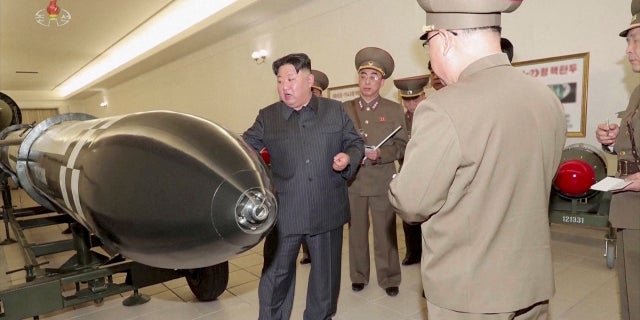 North Korean leader Kim Jong Un inspecting nuclear warheads at an undisclosed location.