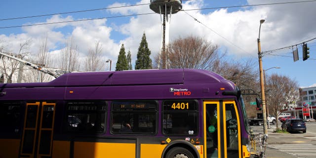 A King County Metro bus drives down 3rd Avenue in Belltown, Monday, April 2, 2018.