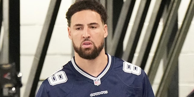 Klay Thompson #11 of the Golden State Warriors arrives at the arena before the game against the Dallas Mavericks on March 22, 2023 at the American Airlines Center in Dallas, Texas.