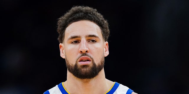 Klay Thompson #11 of the Golden State Warriors looks on during the game against the Houston Rockets at Toyota Center on March 20, 2023 in Houston, Texas.
