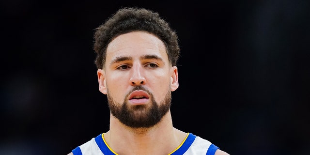 Klay Thompson #11 of the Golden State Warriors looks on during the game against the Houston Rockets at Toyota Center on March 20, 2023 in Houston, Texas.