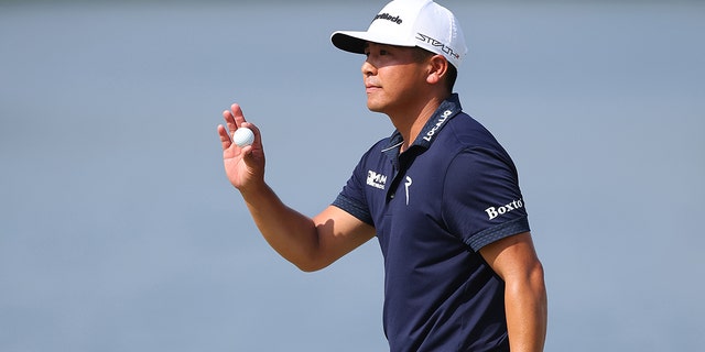 Kurt Kitayama of the United States salutes after birdieing the seventh green during the final round of the Arnold Palmer Invitational presented by Mastercard at the Arnold Palmer Bay Hill Golf Course on March 5, 2023 in Orlando, Florida.