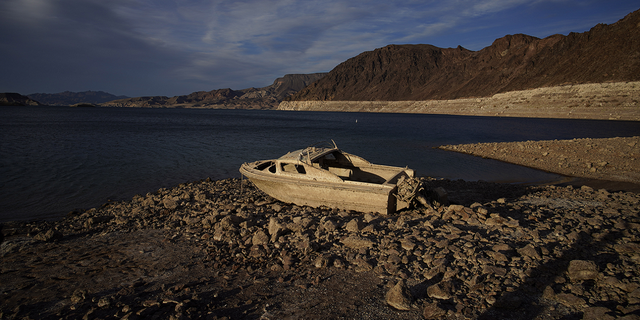 A formerly sunken boat sits along the shoreline of Lake Mead at the Lake Mead National Recreation Area in Nevada in May 2022.