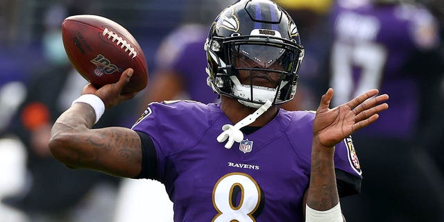 Quarterback Lamar Jackson, #8 of the Baltimore Ravens, warms up before their game against the Jacksonville Jaguars at M&T Bank Stadium on December 20, 2020 in Baltimore.