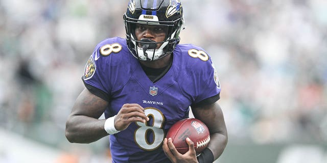 Lamar Jackson, #8 of the Baltimore Ravens, runs with the football during the game against the New York Jets at MetLife Stadium on September 11, 2022 in East Rutherford, New Jersey.