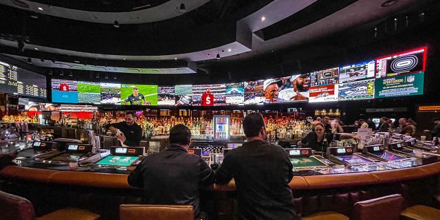 Gamblers flow into Caesars Sports Book at Caesars Palace Hotel &amp; Casino to watch and bet on the Kansas City Chiefs vs Philadelphia Eagles in the National Football League's Super Bowl LVII (which is taking place in Glendale, Arizona) as viewed on February 12, 2023 in Las Vegas, Nevada.