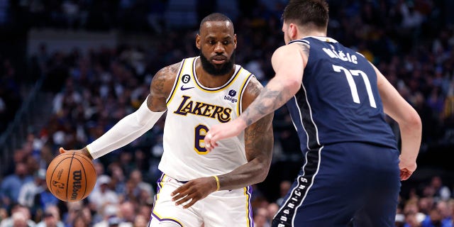 LeBron James (6) of the Los Angeles Lakers handles the ball as Luka Doncic (77) of the Dallas Mavericks defends in the second half at American Airlines Center Feb. 26, 2023, in Dallas, Texas. The Lakers won 111-108.
