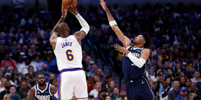 LeBron James (6) of the Los Angeles Lakers shoots the ball as Christian Wood (35) of the Dallas Mavericks defends in the first half of a game at American Airlines Center Feb. 26, 2023, in Dallas, Texas.