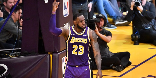 LeBron James of the Lakers scores to pass Michael Jordan and move to No. 4 on the NBA's all-time scoring list during the Denver Nuggets game at Staples Center on March 6, 2019, in Los Angeles.