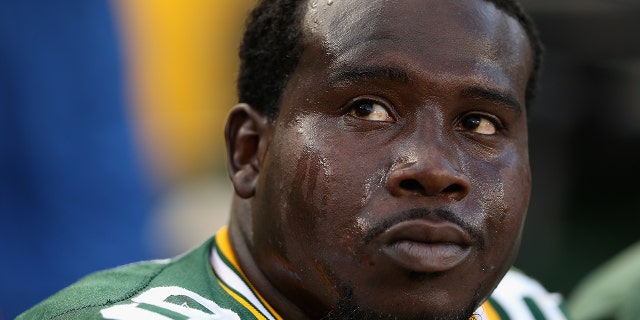 Nose tackle Letroy Guion #98 of the Green Bay Packers on the sidelines during the NFL game against the New York Jets at Lambeau Field on September 14, 2014 in Green Bay, Wisconsin. The Packers defeated the Jets 31-24.