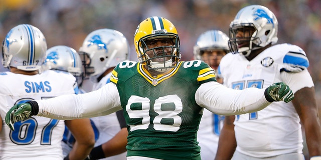 Letroy Guion, #98 of the Green Bay Packers, reacts on a big stop during the first quarter of the game against the Detroit Lions at Lambeau Field on Dec. 28, 2014 in Green Bay, Wisconsin. The Packers defeated the Lions 30-20. 
