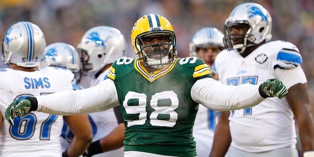 Letroy Guion, #98 of the Green Bay Packers, reacts on a big stop during the first quarter of the game against the Detroit Lions at Lambeau Field on Dec. 28, 2014 in Green Bay, Wisconsin. The Packers defeated the Lions 30-20.