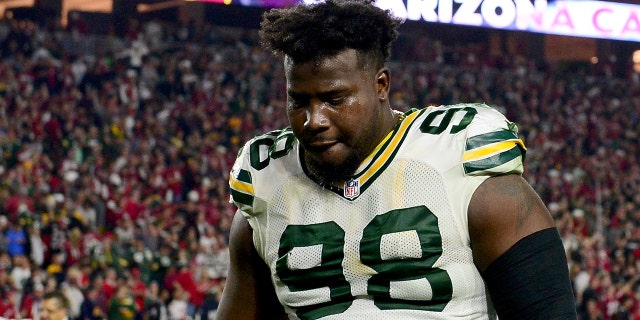 Defensive end Letroy Guion, #98 of the Green Bay Packers, walks off the field after losing in overtime to the Arizona Cardinals 26-20 in the NFC Divisional Playoff Game at University of Phoenix Stadium on Jan. 16, 2016 in Glendale, Arizona.