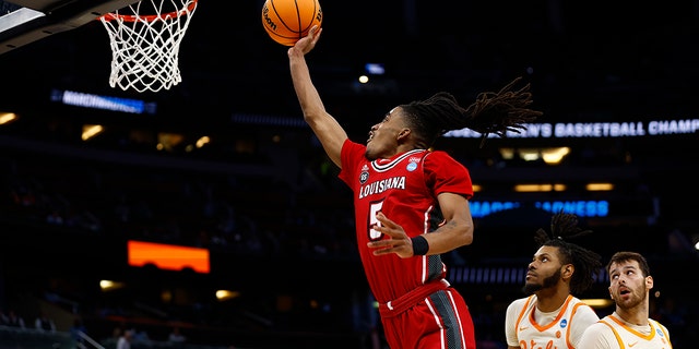 Jalen Dalcourt #5 of the Louisiana Lafayette Ragin Cajuns attempts a layup against the Tennessee Volunteers during the second half of the first round of the NCAA Men's Basketball Tournament at the Amway Center on March 16, 2023 in Orlando, Florida.