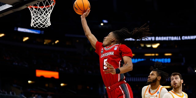 Jalen Dalcourt #5 of the Louisiana Lafayette Ragin Cajuns attempts a lay up against the Tennessee Volunteers during the second half in the first round of the NCAA Men's Basketball Tournament at Amway Center on March 16, 2023 in Orlando, Florida.