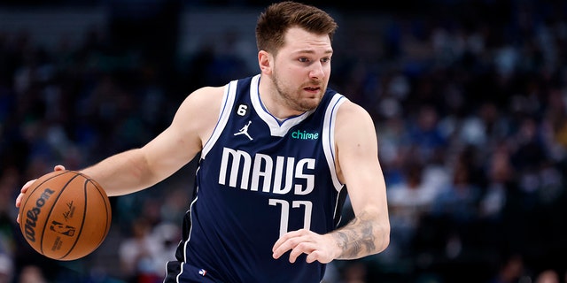 Luka Doncic #77 of the Dallas Mavericks handles the ball against the Phoenix Suns in the first half of the game at the American Airlines Center on March 5, 2023 in Dallas, Texas.