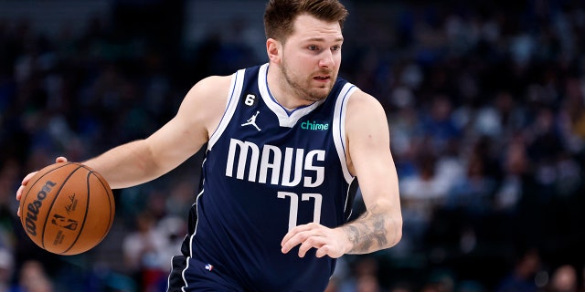 Luka Doncic #77 of the Dallas Mavericks handles the ball against the Phoenix Suns in the first half of the game at the American Airlines Center on March 5, 2023 in Dallas, Texas.