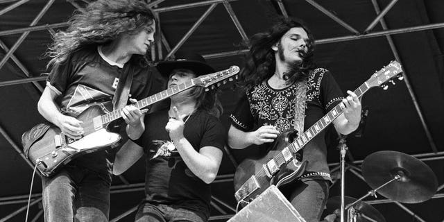 Allen Collins, Ronnie Van Zant and Gary Rossington of Lynyrd Skynyrd perform live at The Oakland Coliseum in 1976.