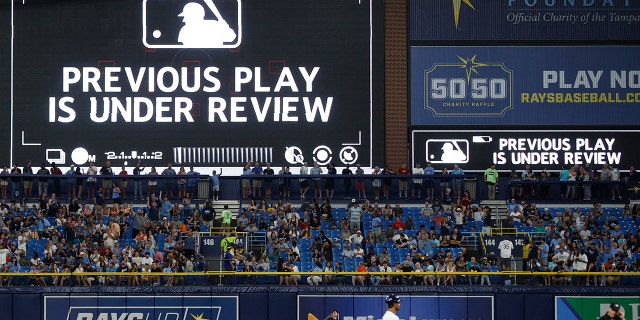 How Zoom will help MLB umpires make replay calls in 2023 season 3 General view during an instant replay review in the MLB game between the Baltimore Orioles and Tampa Bay Rays on July 15, 2022 at Tropicana Field in St. Petersburg, Florida.