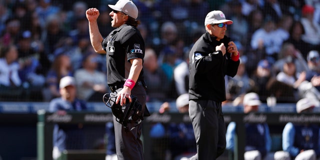 How Zoom will help MLB umpires make replay calls in 2023 season 2 Umpire Chris Guccione #68 calls for an out after a video replay during the game between the Seattle Mariners and the Tampa Bay Rays at T-Mobile Park on May 08, 2022 in Seattle, Washington.