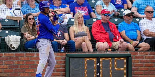 Sergio Alcantara #60 of the Chicago Cubs waits in the shot clock circle in the fourth inning against the Texas Rangers during a spring training game at Surprise Stadium on March 7, 2023 in Surprise, Arizona. 