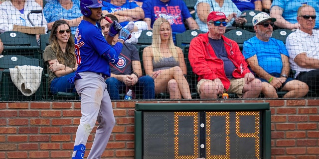 Sergio Alcantara #60 of the Chicago Cubs waits in the shot clock circle in the fourth inning against the Texas Rangers during a spring training game at Surprise Stadium on March 7, 2023 in Surprise, Arizona. 