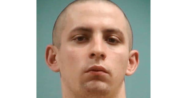 This image provided by the Mississippi Department of Corrections shows Axel Cox of Gulfport, Mississippi, who burned a cross in his front yard to intimidate his Black neighbors in December 2020, was sentenced on March 9, 2023, to 42 years in prison.