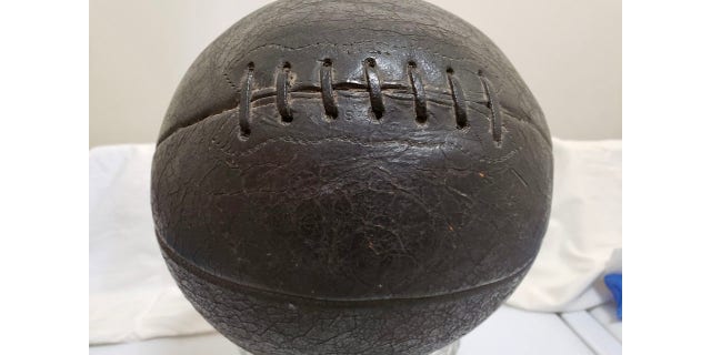 An early-era laced basketball, used by Mount Vernon High School in its 1920 Illinois state championship season. H.V. Porter, the Illinois administrator who coined "March Madness," also pioneered the use of molded basketballs, making laced versions obsolete.