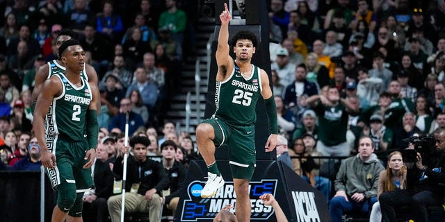 Michigan State forward Malik Hall (25) celebrates a turnover by Marquette in the second half of a second-round college basketball game in the men's NCAA Tournament in Columbus, Ohio, Sunday, March 19, 2023. 