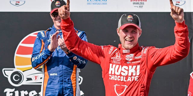 PNC Chip Ganassi Racing driver Scott Dixon, left, applauds as Huski Chocolate Chip Ganassi Racing driver Marcus Ericsson celebrates on the Victory Lane podium after winning the Grand Prix of St. Petersburg car race on Sunday March 5, 2023, in St. Petersburg, Florida. 