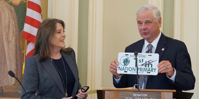 Democratic presidential candidate Marianne Williamson is greeted by New Hampshire state Senate president Jeb Bradley, at the Statehouse in Concord, N.H. on March 9, 2023