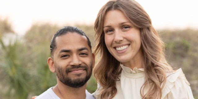 Mario Fernandez and his wife, Shanna Gardner-Fernandez, smiling at a memorial for her slain ex-husband, Jared Bridegan, with whom she shares 10-year-old twins. Fernandez has been charged with Bridegan's murder and Gardner-Fernandez remains a suspect.