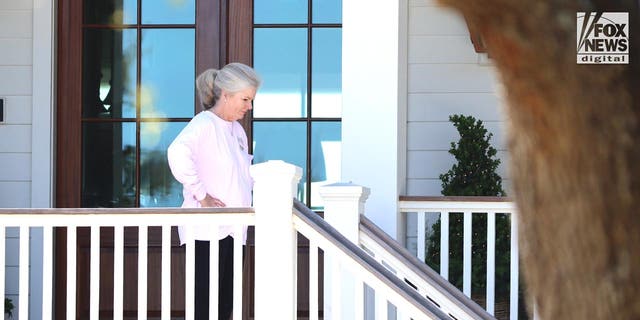 Marian Proctor descends the stairs at her home in Sullivan Island, SC, Sunday, March 5, 2023. This is the first time Proctor, whose sister, Maggie Murdaugh, was murdered by Alex Murdaugh, has been seen since he was sentenced to life for her murder.