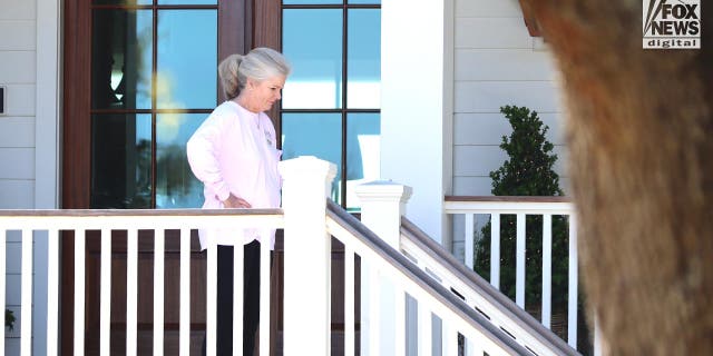 Marian Proctor descends the stairs at her home in Sullivan Island, SC, Sunday, March 5, 2023. This is the first time Proctor, whose sister, Maggie Murdaugh, was murdered by Alex Murdaugh, has been seen since he was sentenced to life for her murder.