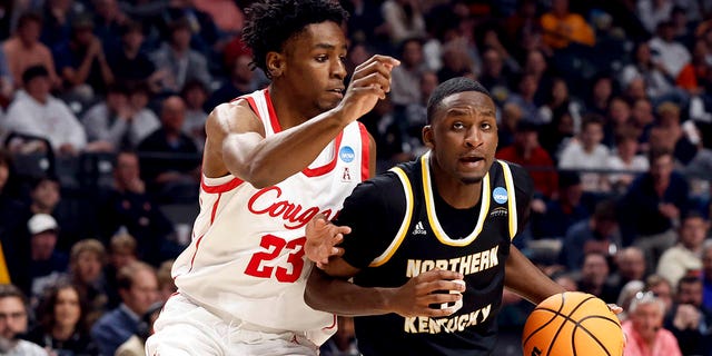 Northern Kentucky guard Marques Warrick (3) drives to the basket around Houston guard Terrance Arceneaux (23) during the second half of a first round college basketball game in the Men's NCAA Tournament in Birmingham, Alabama, on Thursday, March 16, 2023.