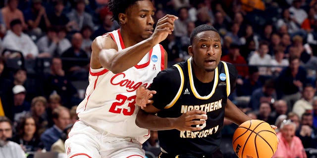 Northern Kentucky guard Marques Warrick (3) drives to the basket around Houston guard Terrance Arceneaux (23) during the second half of a first round college basketball game in the Men's NCAA Tournament in Birmingham, Alabama, on Thursday, March 16, 2023.