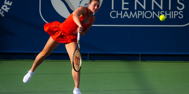 Marta Kostyuk of Ukraine in action against Belinda Bencic of Switzerland during her second round match on Day 3 of the Dubai Duty Free Tennis at Dubai Duty Free Tennis Stadium on February 21, 2023 in Dubai, United Arab Emirates. 