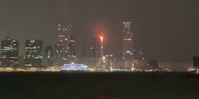 A fire at a Hong Kong skyscraper construction site broke out Thursday, sending flaming embers onto the street below. 