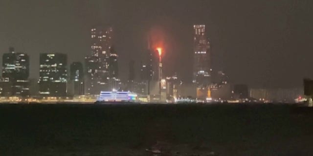 A fire at a Hong Kong skyscraper construction site broke out Thursday, sending flaming embers onto the street below. 