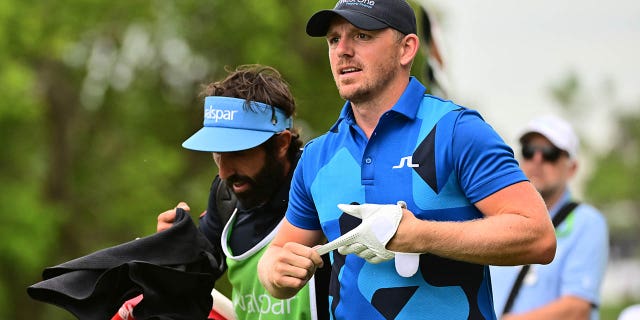 Matt Wallace and caddy Samuel Bernard tee off the second tee at the Valspar Championship at Innisbrook Resort and Golf Club on March 18, 2023.