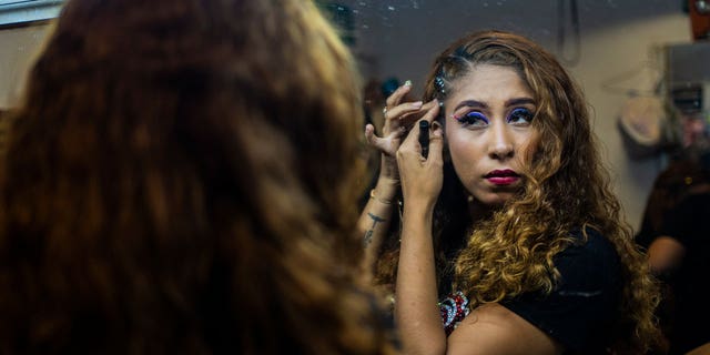 Perla Sanchez gets ready for the semifinals of the first Miss Colonia pageant hosted by the Factoría nightclub in Veracruz, Mexico, on March 5, 2023.