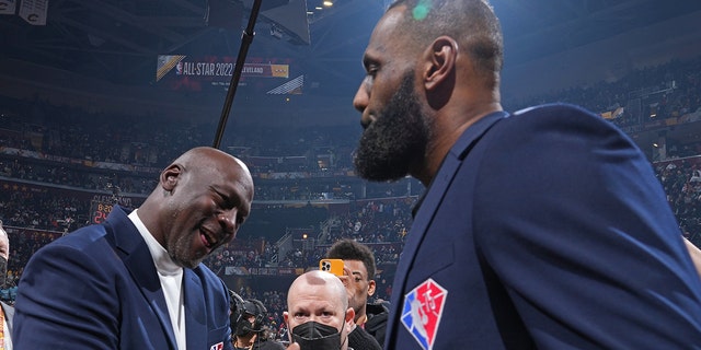 NBA Legends, Michael Jordan and LeBron James shake hands during the NBA All-Star Game on Feb. 20, 2022, at Rocket Mortgage FieldHouse in Cleveland, Ohio.
