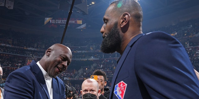 LeBron James and Michael Jordan shake hands