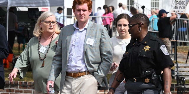 Lynn Murdaugh, Buster Murdaugh and Brooklynn White leave the Colleton County Courthouse in Walterboro, South Carolina, for a lunch break on Wednesday.