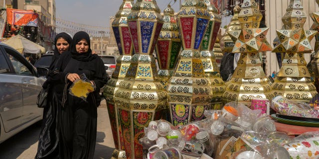 People buy traditional lanterns in Sayyeda Zeinab market ahead of the upcoming Muslim fasting month of Ramadan, in Cairo, Egypt, on March 21, 2023.