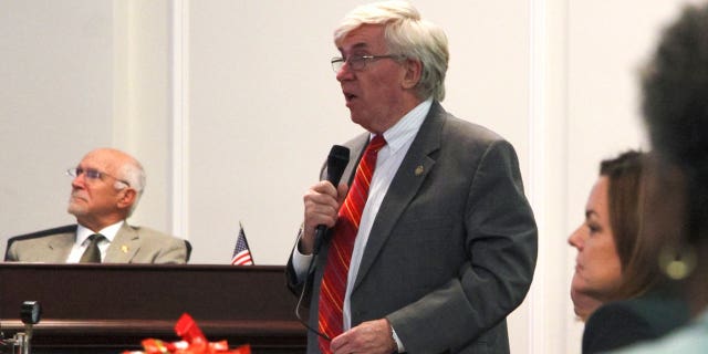 North Carolina Sen. Tom McInnis, a Moore County Republican, presents a bill on the Senate floor that would stiffen penalties for intentionally damaging utility equipment, March 14, 2023, in Raleigh, North Carolina. 